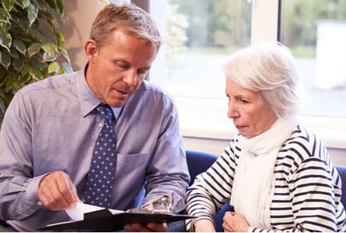 A consultant talks with a patient