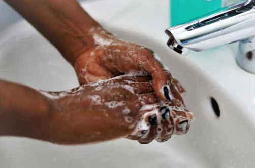 Close up of hands being washed