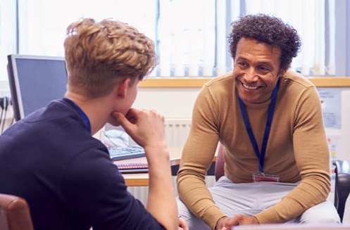 Consultant talks with young man